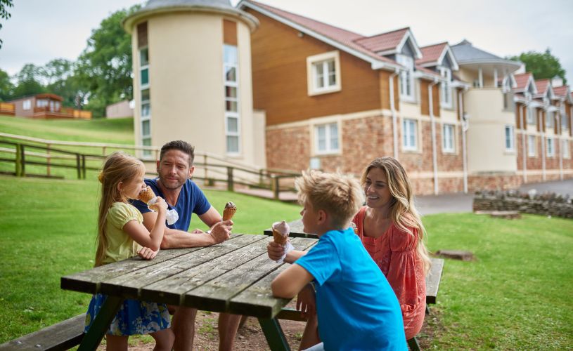 Family sititng outside at Wookey Hole Hotel